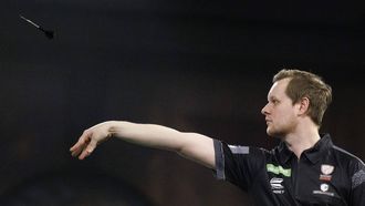 epa11031740 Kevin Doets of The Netherlands plays against Michael Smith of England (not pictured) during the opening session of the Paddy Power World Darts Championship at Alexandra Palace in London, Britain, 15 December 2023.  EPA/TOLGA AKMEN