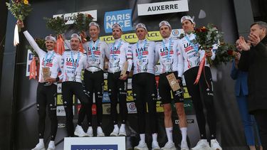 UAE Team Emirates celebrates on the podium after winning the 3rd stage of the Paris-Nice cycling race, 26,9 km team time trial between Auxerre and Auxerre, on March 5, 2024. 
Thomas SAMSON / AFP