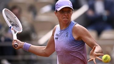 Poland's Iga Swiatek eyes the ball as she plays against Britain's Emma Raducanu during their women's singles match on day 4 of the French Open tennis tournament on Court Philippe-Chatrier at the Roland-Garros Complex in Paris on May 28, 2025. 
JULIEN DE ROSA / AFP
