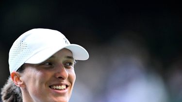 Poland's Iga Swiatek celebrates after winning against Denmark's Clara Tauson during their women's singles fourth round tennis match on the eighth day of the 2025 Wimbledon Championships at The All England Lawn Tennis and Croquet Club in Wimbledon, southwest London, on July 7, 2025. 
Kirill KUDRYAVTSEV / AFP