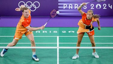 Netherlands' Robin Tabeling (L) hits a shot next to Selena Piek in their mixed doubles badminton group stage match during the Paris 2024 Olympic Games at Porte de la Chapelle Arena in Paris on July 27, 2024. 
David GRAY / AFP