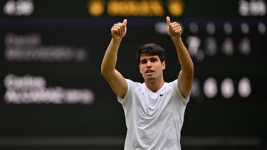 Spain's Carlos Alcaraz celebrates winning against Russia's Daniil Medvedev during their men's singles semi-final tennis match on the twelfth day of the 2024 Wimbledon Championships at The All England Lawn Tennis and Croquet Club in Wimbledon, southwest London, on July 12, 2024. Spain's Carlos Alcaraz won 7-6, 3-6, 4-6, 4-6.
ANDREJ ISAKOVIC / AFP