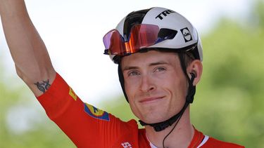 2023-07-14 13:37:19 Lidl - Trek's Danish rider Mattias Skjelmose waves as he awaits the start of the 13th stage of the 110th edition of the Tour de France cycling race, 138 km between Chatillon-sur-Chalaronne in central-eastern France and Grand Colombier, in the Jura mountains in Eastern France, on July 14, 2023. 
Thomas SAMSON / AFP