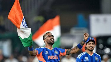 India's Hardik Pandya (L) and his teammate Ishan Kishan celebrate after their team's win in the 2026 ICC Men's T20 Cricket World Cup final match against New Zealand at the Narendra Modi Stadium in Ahmedabad on March 8, 2026. 
Punit PARANJPE / AFP