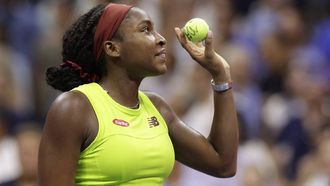 2023-09-08 04:16:35 USA's Coco Gauff gets ready to hit signed balls to the crowd after she defeated Czech Republic's Karolina Muchova during the US Open tennis tournament women's singles semi-finals match at the USTA Billie Jean King National Tennis Center in New York City, on September 7, 2023. 
kena betancur / AFP