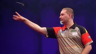 epa10733130 Dimitri Van den Bergh of Belgium throws a dart during a match against Karel Sedlacek of Czech Republic (not seen) in the Poland Darts Masters 2023 tournament, in Warsaw, Poland, 07 July 2023  EPA/Piotr Nowak POLAND OUT