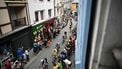 The pack of riders (peloton) cycles through the town of Arreau during the 14th stage of the 112th edition of the Tour de France cycling race, 182.6 km between Pau and Luchon-Superbagneres, in the Pyrenees mountains of southwestern France, on July 19, 2025. 
Loic VENANCE / AFP