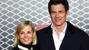 Mercedes team principal Toto Wolff (R) and his wife Swiss pilot Susie Wolff pose on the red carpet upon arrival for the UK premier of 