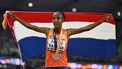 2023-08-26 23:08:52 Netherlands' silver medallist Sifan Hassan celebrates with her national flag after the women's 5000m final during the World Athletics Championships at the National Athletics Centre in Budapest on August 26, 2023. 
Jewel SAMAD / AFP