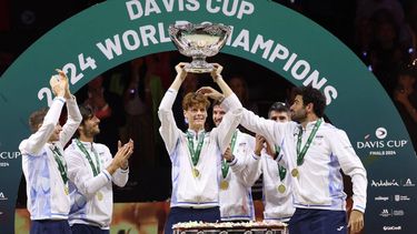 Italy's Jannik Sinner raises the trophy with teammates after winning the Davis Cup Finals at the Palacio de Deportes Jose Maria Martin Carpena arena in Malaga, southern Spain, on November 24, 2024. 
Thomas COEX / AFP