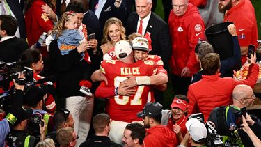Kansas City Chiefs' tight end #87 Travis Kelce and Kansas City Chiefs' quarterback #15 Patrick Mahomes hug after winning Super Bowl LVIII against the San Francisco 49ers at Allegiant Stadium in Las Vegas, Nevada, February 11, 2024. 
Patrick T. Fallon / AFP
