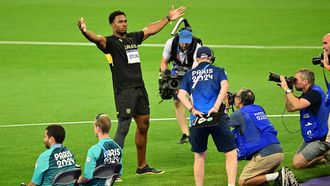 Jamaica's Roje Stona celebrates winning the men's discus throw final and setting the new Olympic record during athletics competitions at the Paris 2024 Olympic Games at Stade de France in Saint-Denis, north of Paris, on August 7, 2024. 
Martin  BERNETTI / AFP