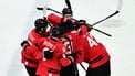 Canada's #27 Shea Theodore (L) celebrates with teammates after scoring his team's second goal during the men's play-off semi-final ice hockey match between Canada and Finland at the Milano Santagiulia Ice Hockey Arena during the Milano Cortina 2026 Winter Olympic Games in Milan, on February 20, 2026. 
JULIEN DE ROSA / AFP