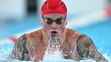 Britain's Adam Peaty competes in the final of the men's 100m breaststroke swimming event during the Paris 2024 Olympic Games at the Paris La Defense Arena in Nanterre, west of Paris, on July 28, 2024. 
Manan VATSYAYANA / AFP