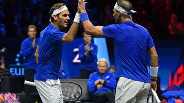 Switzerland's Roger Federer (L) reacts with Spain's Rafael Nadal (R) of Team Europe playing against USA's Jack Sock and USA's Frances Tiafoe of Team World during their 2022 Laver Cup men's doubles tennis match at the O2 Arena in London on September 23, 2022. Roger Federer brings the curtain down on his spectacular career in a 