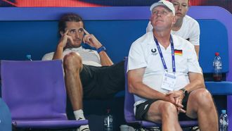 Germany’s Alexander Zverev (L), who pulled out of the event due to an injury, watches teammate Daniel Masur in his men's singles match against Kazakhstan’s Alexander Shevchenko at the United Cup tennis tournament in Perth on January 1, 2025. 
COLIN MURTY / AFP