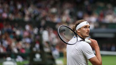 Germany's Alexander Zverev reacts as he plays against US player Taylor Fritz during their men's singles tennis match on the eighth day of the 2024 Wimbledon Championships at The All England Lawn Tennis and Croquet Club in Wimbledon, southwest London, on July 8, 2024. 
HENRY NICHOLLS / AFP