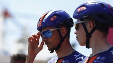 Team Picnic PostNL French rider Warren Barguil (L) looks on as he prepares to compete in the 12th stage of the Giro d'Italia 2026 - Tour of Italy cycling race between Imperia and Novi Ligure, Italy, on May 21, 2026. 
Luca Bettini / AFP