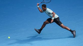 France's Gael Monfils hits a return against USA's Ben Shelton during their men's singles match on day nine of the Australian Open tennis tournament in Melbourne on January 20, 2025. 
Adrian DENNIS / AFP