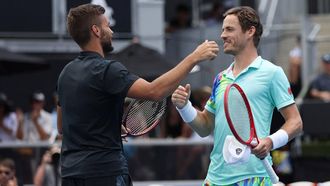 Netherlands' Wesley Koolhof (R) and partner Nikola Mektic of Croatia celebrate their win against Spain's Marcel Granollers and Argentina's Horacio Zeballos during their men's doubles final match of the Auckland Classic tennis tournament in Auckland on January 13, 2024. 
MICHAEL BRADLEY / AFP