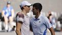 epa11105016 Jannik Sinner of Italy and Novak Djokovic of Serbia hug after Sinner's victory in the Men's semi final match at the Australian Open tennis tournament in Melbourne, Australia, 26 January 2024.  EPA/MAST IRHAM