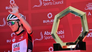 UAE Team Emirates' Slovenian rider Tadej Pogacar waves on stage ahead of the seventh stage of the UAE Tour cycling race from Hazza Bin Zayed Stadium to Jebel Hafeet in the United Arab Emirates, on February 23, 2025. 
Giuseppe CACACE / AFP