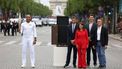 epa11477215 Thierry Henry holds the Paris 2024 Olympic flame with Mayor of Paris, Anne Hidalgo and CIO President, Tony Estanguet as the Olympic Torch Relay arrives in Paris, France, 14 July 2024. The Olympic torch relay arrived in Paris on Bastille Day, the country's national holiday, and will visit some of the city's most famous landmarks on 14 and 15 July. In May 2024, the Olympic flame began its journey across France, including five overseas regions, visiting hundreds of towns and cities before the Olympic Games Opening Ceremony on 26 July.  EPA/JULIEN MATTIA