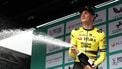 Team Visma Lease a Bike's Dutch rider Olav Kooij sprays the champagne on the podium as he celebrates winning the sixth stage of the Tour of Britain cycling race, in Cardiff on September 7, 2025. 
Darren Staples / AFP