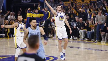 epa12034178 Golden State Warriors center Quinten Post (R) reacts after shooting a three point basket against the Memphis Grizzlies during the first half of the NBA Play-In Tournament game between the Memphis Grizzlies and the Golden State Warriors in San Francisco, California, USA, 15 April 2025. The winner will earn the NBA Western Conference 7 seed.  EPA/JOHN G. MABANGLO  SHUTTERSTOCK OUT