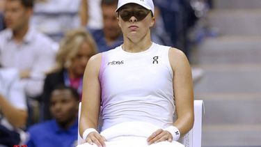 Poland's Iga Swiatek sits between games as she plays against USA's Jessica Pegula during their women's quarterfinals match on day ten of the US Open tennis tournament at the USTA Billie Jean King National Tennis Center in New York City, on September 4, 2024. 
Kena Betancur / AFP