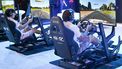 Visitors try out a race simulator before the start of the competition during the Olympics Esports Week in Singapore on June 22, 2023. 
Roslan RAHMAN / AFP