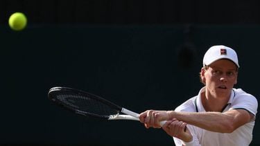 Italy's Jannik Sinner returns to Serbia's Novak Djokovic during their men's singles semi-final tennis match on the twelfth day of the 2026 Wimbledon Championships at The All England Lawn Tennis and Croquet Club in Wimbledon, southwest London, on July 10, 2026. 
HENRY NICHOLLS / AFP