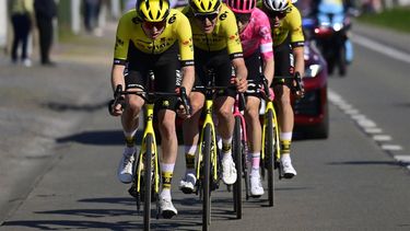 Team Visma-Lease a Bike's Belgian rider Tiesj Benoot (L), American rider Matteo Jorgenson, EF Education-EasyPost's US rider Neilson Powless and Belgian rider Wout van Aert cycle during the men's elite race 'Dwars Door Vlaanderen', 184,2 km from Roeselare to Waregem, on April 2, 2025. 
DIRK WAEM / Belga / AFP