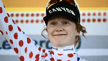 Fenix-Deceuninck's Dutch rider Puck Pieterse celebrates on the podium with the best climber's polka dot (dotted) jersey after the 6th (out of 9) stage of the fifth edition of the Women's Tour de France cycling race, 153.4 km from Montbrison to Tournon-sur-Rhone, in Tournon-sur-Rhone, central-eastern France on August 6, 2026. 
NICOLAS TUCAT / AFP