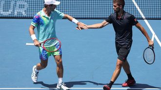 Netherlands' Wesley Koolhof (L) and partner Nikola Mektic of Croatia celebrate a point against Spain's Marcel Granollers and Argentina's Horacio Zeballos during their men's doubles final match of the Auckland Classic tennis tournament in Auckland on January 13, 2024. 
MICHAEL BRADLEY / AFP