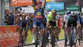 Team Lidl-Trek's Danish rider Mads Pedersen (C) celebrates as he crosses the finish line to win the first stage of the 76th edition of the Criterium du Dauphine cycling race, 172,5km between in Saint-Pourcain-sur-Sioule, central France, on June 2, 2024. 
Thomas SAMSON / AFP