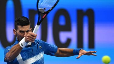 Serbia's Novak Djokovic hits a return to Italy's Matteo Berettini during their men's singles match at the ATP Qatar Open tennis tournament in Doha on February 18, 2025. 
Mahmud HAMS / AFP