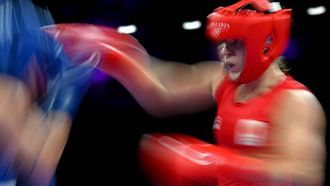 Netherlands' Chelsey Heijnen (in red) punches Brazil's Beatriz Iasmin Soares Ferreira in the women's 60kg quarter-final boxing match during the Paris 2024 Olympic Games at the North Paris Arena, in Villepinte on July 31, 2024. 
MOHD RASFAN / AFP