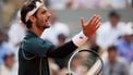 Italy's Lorenzo Musetti reacts during his men's singles quarter-final match against US Frances Tiafoe on day 10 of the French Open tennis tournament on Court Philippe-Chatrier at the Roland-Garros Complex in Paris on June 3, 2025. 
Dimitar DILKOFF / AFP