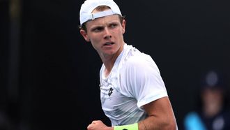 Dutch Jesper De Jong reacts on a point against Argentina's Pedro Cachin during their men's singles match on day one of the Australian Open tennis tournament in Melbourne on January 14, 2024. 
Martin KEEP / AFP