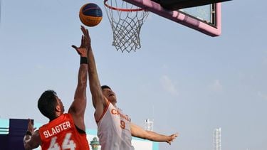 Netherlands' #44 Arvin Slagter (L) fights for the ball with China's #09 Lu Wenbo in the men's pool round 3x3 basketball game between China and the Netherlands during the Paris 2024 Olympic Games at La Concorde in Paris on July 30, 2024. 
David GRAY / AFP