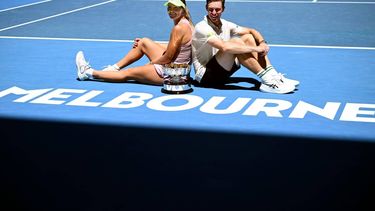 epa12691863 Olivia Gadecki (L) and John Peers (R) of Australia pose with the trophy following their win over Kristina Mladenovic and Manuel Guinard of France in the mixed doubles final match on day 13 of the Australian Open tennis tournament in Melbourne, Australia, 30 January 2026.  EPA/JOEL CARRETT AUSTRALIA AND NEW ZEALAND OUT