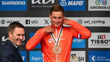 Third-placed Netherlands' Mathieu van der Poel celebrates during the podium ceremony of the men's Elite Road Race cycling event as part of the UCI 2024 Road World Championships, in Zurich, on September 29, 2024. 
Fabrice COFFRINI / AFP