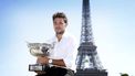 epa04789254 Stan Wawrinka of Switzerland poses with the winner's trophy near the Eiffel tower after winning the men's final of the French Open tennis championships at Roland Garros, Paris, France, 08 June 2015.  EPA/ETIENNE LAURENT