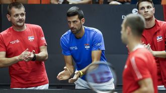 2023-09-16 14:06:55 epa10864555 Serbia's Novak Djokovic reacts as his teammate Laslo Djere and Czech Republic's Jiri Lehecka play during the 2023 Davis Cup C Group tennis match between Czech Republic and Serbia, in Valencia, eastern Spain, 16 September 2023.  EPA/Kai Foesterling