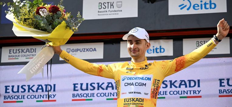 Team Decathlon CMA CGM's French rider Paul Seixas, the overall race leader and winner of the fifth stage of the Basque Country's Itzulia cycling tour, a 176.2 km race starting and finishing in Eibar, celebrates on the podium on April 10, 2026.  
ANDER GILLENEA / AFP