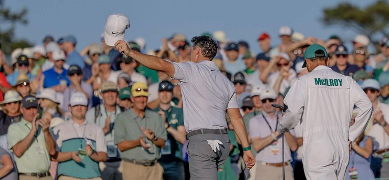 epa12881906 Rory McIlroy (L) of Northern Ireland walks off the green 18th hole with his caddie Harry Diamond (R) during the second round of the 2026 Masters Tournament at the Augusta National Golf Club in Augusta, Georgia, USA, 10 April 2026.  EPA/ERIK S. LESSER