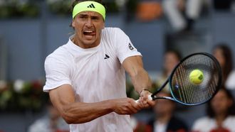 Germany's Alexander Zverev returns the ball to Argentina's Francisco Cerundolo during their 2025 ATP Tour Madrid Open tennis tournament fourth round singles match at the Caja Magica in Madrid, on April 29, 2025. 
Pierre-Philippe MARCOU / AFP