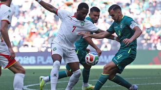 Suriname's forward #07 Gyrano Kerk and Bolivia's defender #04 Luis Haquin fight for the ball during the 2026 FIFA World Cup qualifiers semi-final playoff football match between Bolivia and Suriname at the BBVA Stadium in Guadalupe, Mexico on March 26, 2026. 
Julio Cesar AGUILAR / AFP