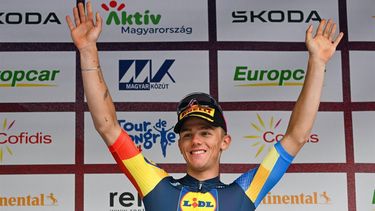 epa11331798 Belgium's Thibau Nys of the team Lidl-Trek celebrates on the podium after winning the third stage of the 45th Tour de Hongrie cycling race over 183 km between Kazincbarcika and Kekesteto, Hungary, 10 May 2024. Nys took over the overall lead.  EPA/Tibor Illyes HUNGARY OUT